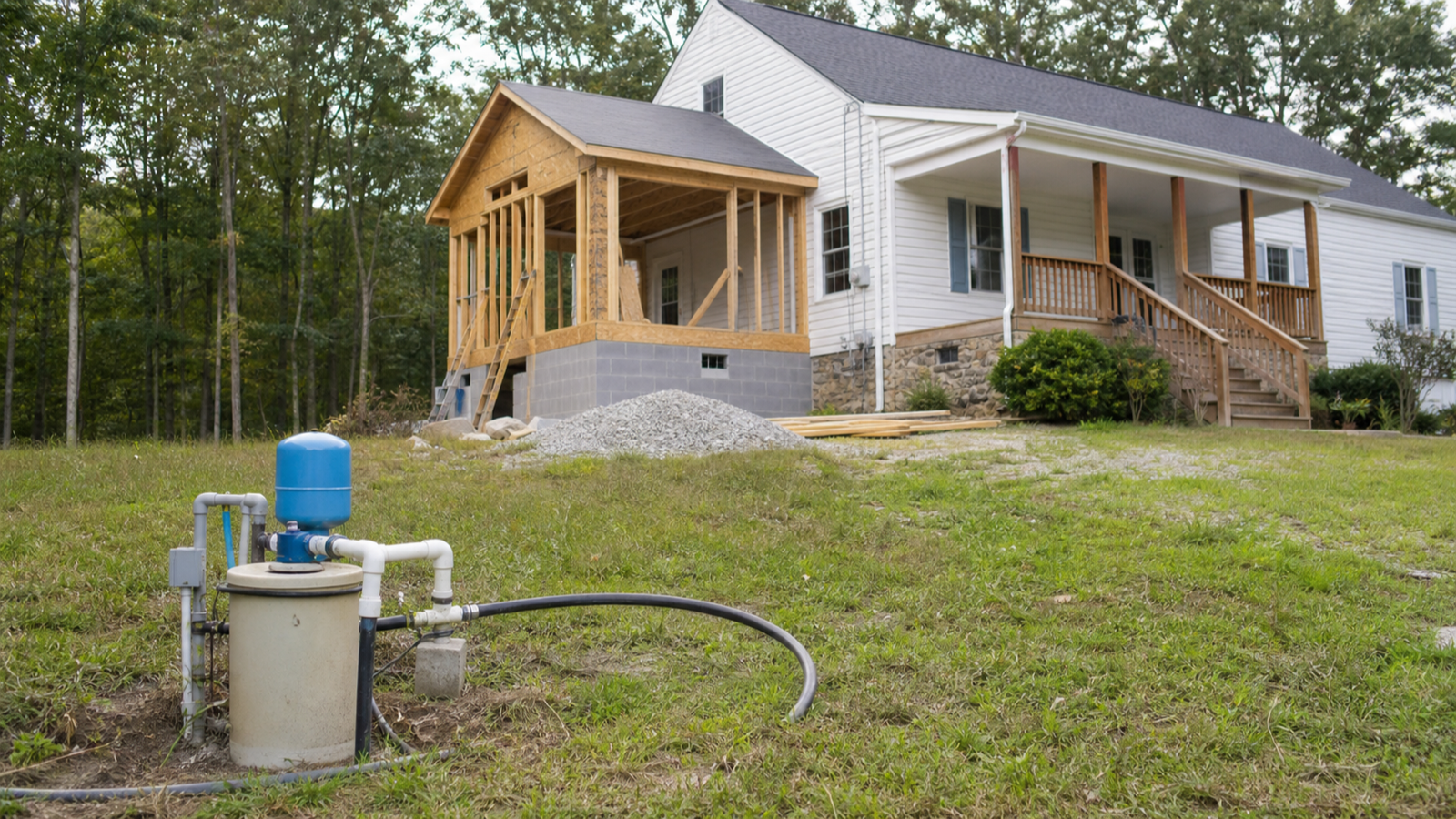 A rural Upper Cumberland home under expansion with a well head in the yard